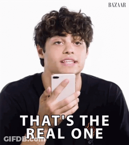 A Man Holding A Cell Phone With The Words That 'S The Real One GIF