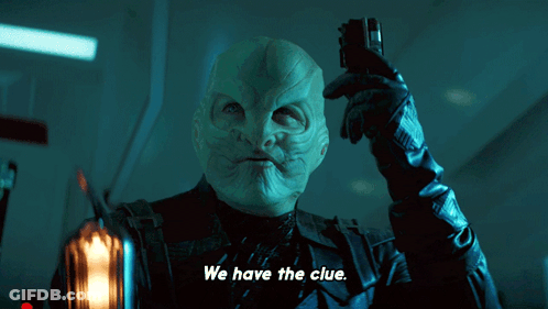 A Man Holding A Cell Phone With The Words We Have The Clue Above Him GIF