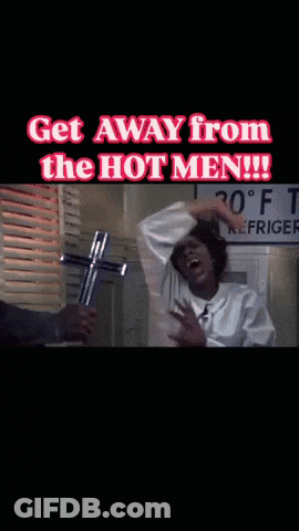 A Man Holding A Cross With The Words Get Away From The Hot Men GIF