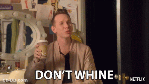 A Man Holding A Cup Of Coffee And Saying " Don 'T Whine " GIF