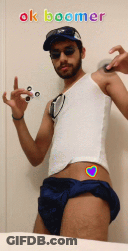 A Man Holding A Fidget Spinner With The Words Ok Boomer Written Above Him GIF