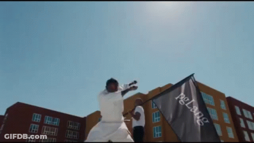 A Man Holding A Flag That Says Pglang GIF