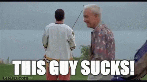 A Man Holding A Golf Club Standing Next To Another Man With The Words `` This Guy Sucks ! '' GIF
