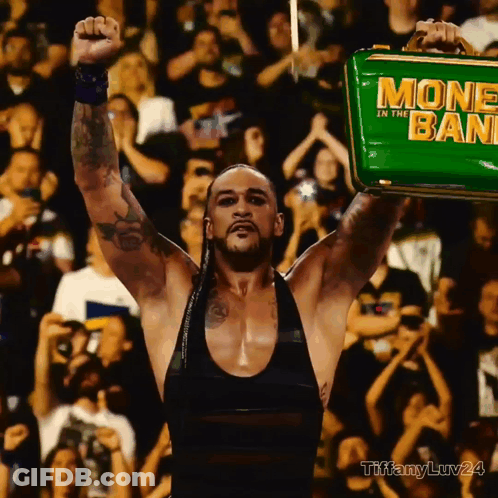 A Man Holding A Green Money In The Bank GIF