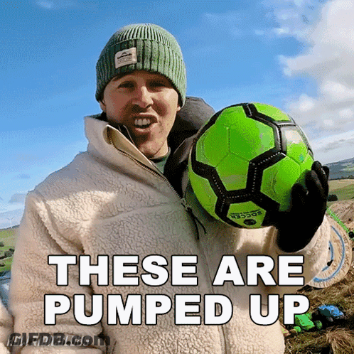 A Man Holding A Green Soccer Ball With The Words " These Are Pumped Up " Above Him GIF