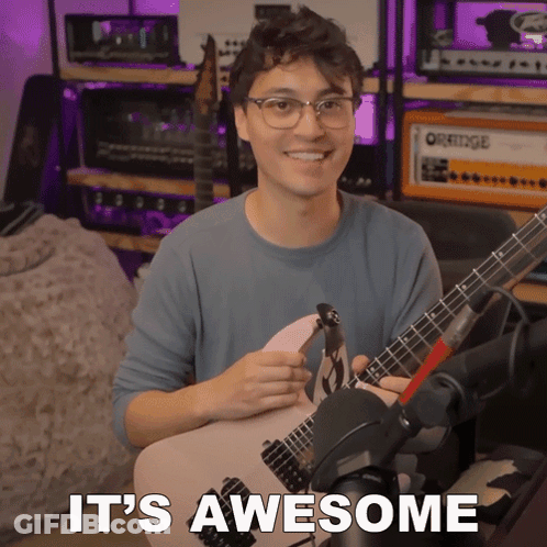 Man Holding Guitar Saying It's Awesome GIF