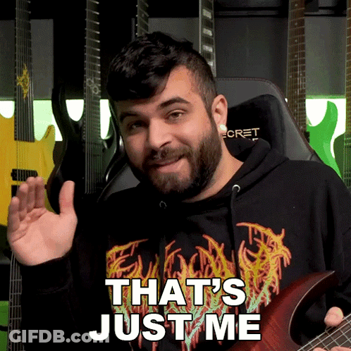 A Man Holding A Guitar With The Words That 'S Just Me On His Shirt GIF