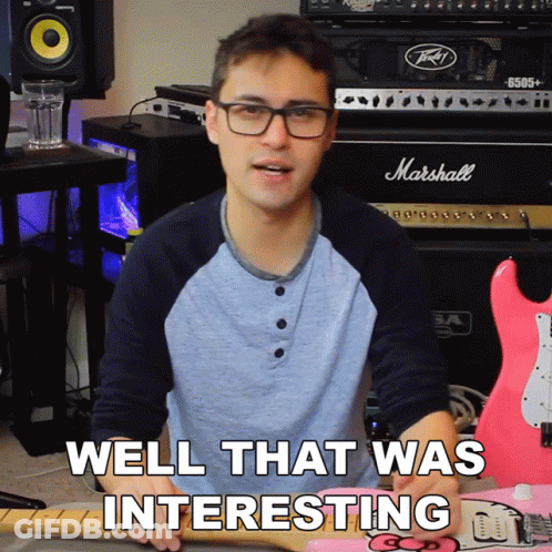 A Man Holding A Guitar With The Words Well That Was Interesting Below Him GIF
