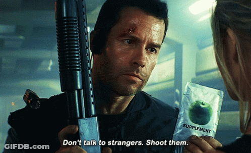 A Man Holding A Gun And A Packet Of Supplements Says " Don 'T Talk To Strangers Shoot Them " GIF