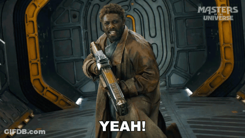 A Man Holding A Gun And Saying Yeah In Front Of Masters Of The Universe GIF