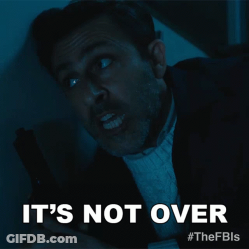 A Man Holding A Gun With The Words It 'S Not Over Above Him GIF