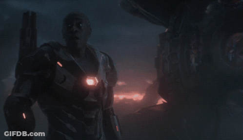 A Man Holding A Gun With The Words It 'S Really Helpful Below Him GIF