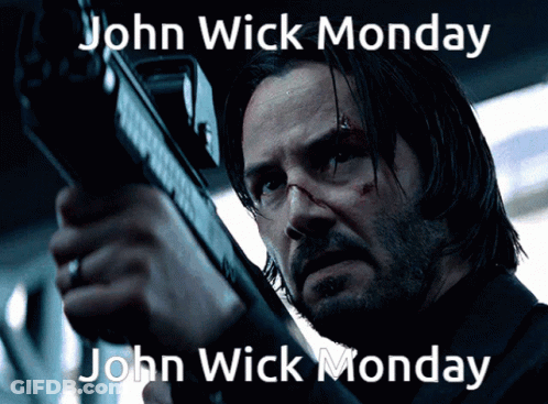 A Man Holding A Gun With The Words John Wick Monday On The Bottom GIF