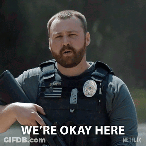 A Man Holding A Gun With The Words We 'Re Okay Here On The Bottom GIF