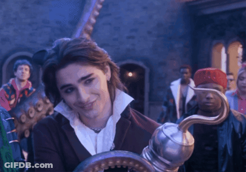 A Man Holding A Hook In Front Of A Crowd GIF