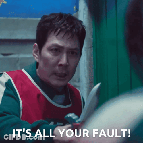A Man Holding A Knife With The Words " It 'S All Your Fault " Below Him GIF