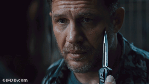 A Man Holding A Knife With The Words Say When Written On The Bottom GIF