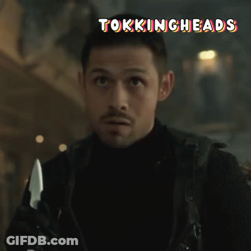 A Man Holding A Knife With The Words Tokingheads Written Above Him GIF
