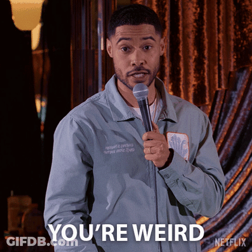 A Man Holding A Microphone And Saying You 'Re Weird On Netflix GIF