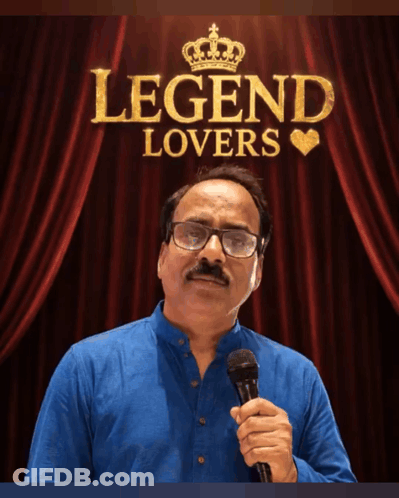 A Man Holding A Microphone In Front Of A Red Curtain That Says Legend Lovers On It GIF