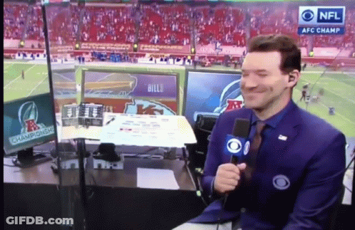A Man Holding A Microphone In Front Of A Screen That Says Nfl Afc Champions GIF