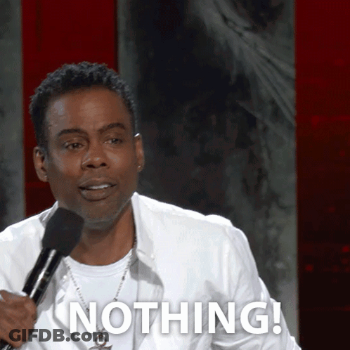 A Man Holding A Microphone Says Nothing In Front Of A Red Wall GIF