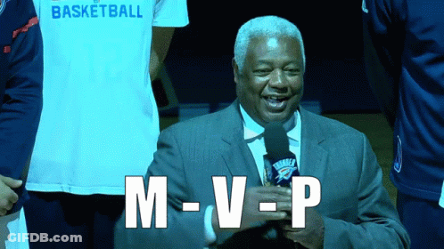 A Man Holding A Microphone With The Word M-V-P Written On It GIF