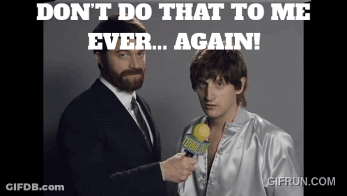 A Man Holding A Microphone With The Words " Don T Do That To Me Ever Again " On The Top GIF