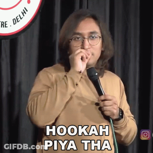 A Man Holding A Microphone With The Words Hookah Piya Tha Written On It GIF