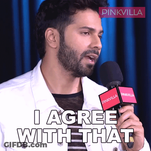 A Man Holding A Microphone With The Words I Agree With That On It GIF