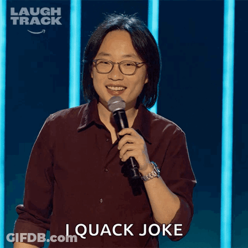 Man Holding Microphone With I Quack Joke GIF