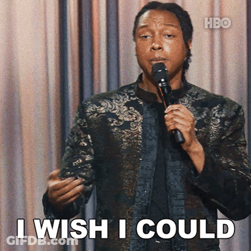 A Man Holding A Microphone With The Words I Wish I Could Below Him GIF
