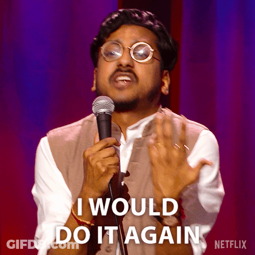 A Man Holding A Microphone With The Words I Would Do It Again On The Bottom GIF