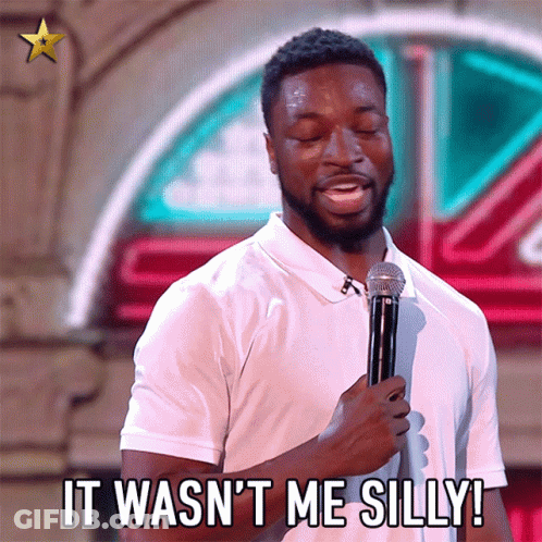 A Man Holding A Microphone With The Words It Wasn 'T Me Silly GIF