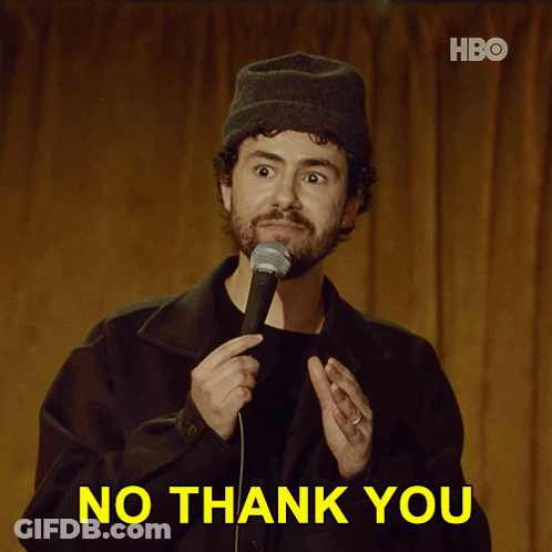 A Man Holding A Microphone With The Words No Thank You Behind Him GIF