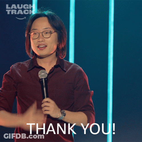 A Man Holding A Microphone With The Words Thank You Below Him GIF