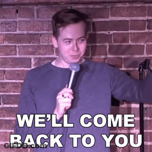 A Man Holding A Microphone With The Words We 'Ll Come Back To You Behind Him GIF