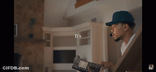A Man Holding A Notebook That Says It 'S On The Bottom GIF
