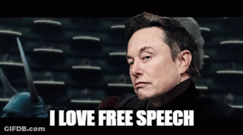 A Man Holding A Pair Of Scissors With The Words I Love Free Speech Behind Him GIF