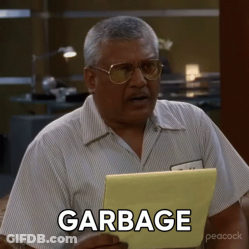 A Man Holding A Piece Of Paper That Says Garbage On It GIF