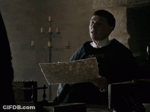 A Man Holding A Piece Of Paper That Says " Paper Says " GIF