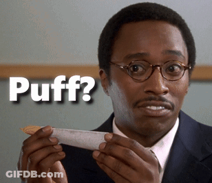 A Man Holding A Piece Of Paper With The Word Puff Written On It GIF