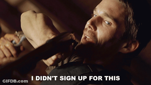 A Man Holding A Piece Of Wood With The Words " I Did N't Sign Up For This " Above Him GIF