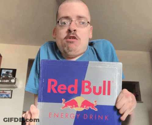 A Man Holding A Red Bull Energy Drink GIF