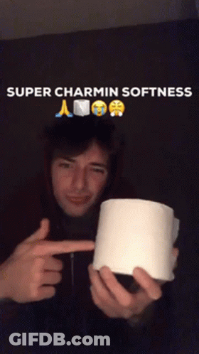 A Man Holding A Roll Of Toilet Paper With The Caption Super Charmin Softness Above Him GIF