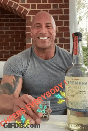 A Man Holding A Shot Glass Next To A Bottle Of Tequila That Says " Cheers Everybody " GIF