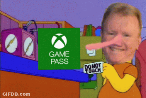 A Man Holding A Sign That Says Do Not Touch In Front Of An Xbox Logo GIF