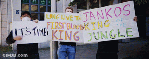 A Man Holding A Sign That Says Long Live The Jankos Of The First Blocking Of The Jungle GIF