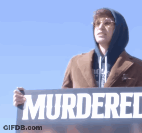 Man Holding Sign Murdered GIF