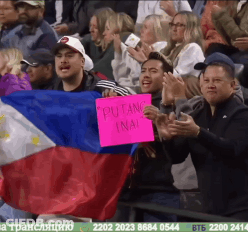 A Man Holding A Sign That Says " Putang Ina " GIF